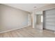 Neutral bedroom with wood-look floors and closet with mirror doors at 7300 Pirates Cove Rd # 1032, Las Vegas, NV 89145