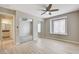 Bedroom with large window and closet; bathroom adjacent at 7300 Pirates Cove Rd # 1032, Las Vegas, NV 89145