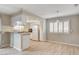 Open kitchen and dining area with bar seating and lots of natural light at 7300 Pirates Cove Rd # 1032, Las Vegas, NV 89145