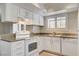 The kitchen includes granite counters, ample storage and modern appliances at 7300 Pirates Cove Rd # 1032, Las Vegas, NV 89145