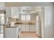 Bright kitchen features white cabinets, granite counters, and stainless steel appliances at 7300 Pirates Cove Rd # 1032, Las Vegas, NV 89145