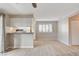 Open living space with wood look floors, views of the kitchen and bright natural light at 7300 Pirates Cove Rd # 1032, Las Vegas, NV 89145