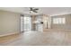 Bright living room area features wood-look floors and access to kitchen and exterior balcony at 7300 Pirates Cove Rd # 1032, Las Vegas, NV 89145