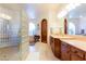 Beautiful bathroom showcases glass block shower, arched windows, and elegant fixtures at 8120 W Red Coach Ave, Las Vegas, NV 89129