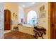 Elegant bathroom featuring a soaking tub, arched window, and classic decor at 8120 W Red Coach Ave, Las Vegas, NV 89129
