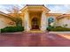 Grand entrance with stately columns and a covered porch welcomes you to this exquisite residence at 8120 W Red Coach Ave, Las Vegas, NV 89129