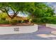 Landscaped front yard with mature trees provides shade and curb appeal to this charming property at 8120 W Red Coach Ave, Las Vegas, NV 89129
