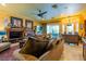Cozy living room with a fireplace and plush seating offers a relaxing retreat at 8120 W Red Coach Ave, Las Vegas, NV 89129