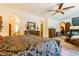 Open bedroom features a fireplace, sitting area, and views of other rooms through arched doorways at 8120 W Red Coach Ave, Las Vegas, NV 89129