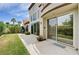 Spacious backyard featuring a covered patio, lush lawn, and mature trees for privacy at 8224 Horseshoe Bend Ln, Las Vegas, NV 89113