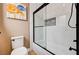 Bathroom with modern fixtures including glass enclosed shower, white tile, and stylish art at 8224 Horseshoe Bend Ln, Las Vegas, NV 89113