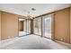 Cozy bedroom with mirrored closet doors and sliding glass doors to the balcony at 8224 Horseshoe Bend Ln, Las Vegas, NV 89113