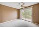 The bedroom boasts a ceiling fan and sliding glass doors to a private balcony at 8224 Horseshoe Bend Ln, Las Vegas, NV 89113