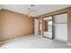 Bedroom with mirrored closet doors and balcony overlooking the community at 8224 Horseshoe Bend Ln, Las Vegas, NV 89113