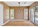 Dining area features wood floors, modern light fixture, and natural light at 8224 Horseshoe Bend Ln, Las Vegas, NV 89113