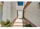 Elegant white front door with sidelights and a tiled entryway at 8224 Horseshoe Bend Ln, Las Vegas, NV 89113