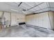 Spacious garage with built-in cabinets, workbench, and ample storage space at 8224 Horseshoe Bend Ln, Las Vegas, NV 89113