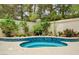 Inviting pool with integrated spa and lush landscaping, perfect for relaxation at 8224 Horseshoe Bend Ln, Las Vegas, NV 89113