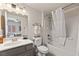 Clean bathroom featuring a vanity, toilet, and shower-tub combination with white tiling at 890 Kitty Hawk Dr # 2412, Mesquite, NV 89027