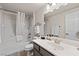Clean bathroom with a shower-tub combo, ample lighting and modern fixtures at 890 Kitty Hawk Dr # 2412, Mesquite, NV 89027