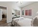 Comfortable bedroom with mirrored closet doors, a cozy bed, and a tranquil atmosphere at 890 Kitty Hawk Dr # 2412, Mesquite, NV 89027
