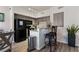 Well-lit kitchen features granite countertops, a breakfast bar, and modern appliances at 890 Kitty Hawk Dr # 2412, Mesquite, NV 89027