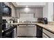 Close-up of updated kitchen features granite counters and modern appliances at 890 Kitty Hawk Dr # 2412, Mesquite, NV 89027