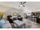 Open living area featuring a comfortable lounge, a dining area, and a partial view of the kitchen at 890 Kitty Hawk Dr # 2412, Mesquite, NV 89027