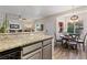 Bright open-concept featuring a round table and a view from the kitchen to the living room at 890 Kitty Hawk Dr # 2412, Mesquite, NV 89027