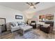 Inviting living room featuring neutral tones, comfortable seating, and a ceiling fan at 890 Kitty Hawk Dr # 2412, Mesquite, NV 89027