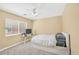 Bedroom featuring neutral carpet, a queen bed, natural light, and a ceiling fan at 9031 Jumping Jacks Ave, Las Vegas, NV 89178