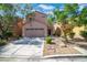 Charming two-story home featuring a two-car garage and a well-maintained landscaped front yard at 9031 Jumping Jacks Ave, Las Vegas, NV 89178