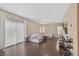 Spacious living room with hardwood floors and ample natural light perfect for relaxation and entertainment at 9031 Jumping Jacks Ave, Las Vegas, NV 89178