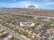 Aerial view of a neighborhood with Lone Mountain visible in the distance; located at 9047 Harbor Wind Ave at 9047 Harbor Wind Ave, Las Vegas, NV 89178
