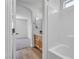 The stylish bathroom features a shower-tub combo and a modern vanity, complemented by updated fixtures at 9047 Harbor Wind Ave, Las Vegas, NV 89178