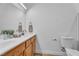 Bathroom featuring double sinks, a toilet, and ample counter space at 9047 Harbor Wind Ave, Las Vegas, NV 89178