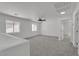 Upstairs bonus room with carpet and natural light from two windows at 9047 Harbor Wind Ave, Las Vegas, NV 89178