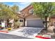 Charming two-story home with a well-maintained front yard and gray garage door at 9047 Harbor Wind Ave, Las Vegas, NV 89178