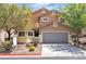 Charming two-story home with a well-maintained yard and attached two-car garage in a residential neighborhood at 9047 Harbor Wind Ave, Las Vegas, NV 89178