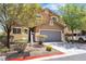 Charming two-story home with a well-maintained yard and attached two-car garage in a residential neighborhood at 9047 Harbor Wind Ave, Las Vegas, NV 89178