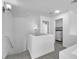 Upstairs hallway featuring a doorway into a bedroom and a laundry room with appliances at 9047 Harbor Wind Ave, Las Vegas, NV 89178
