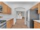 Open kitchen with stainless steel appliances and connecting living area at 9047 Harbor Wind Ave, Las Vegas, NV 89178