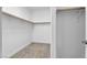 Walk-in closet offering built-in shelving and hanging rods for optimal organization at 9047 Harbor Wind Ave, Las Vegas, NV 89178