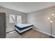 Bedroom with a bed, a window providing natural light, and modern flooring at 9070 Spring Mountain Rd # 114, Las Vegas, NV 89117