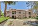 Attractive multi-story apartment building with mature trees and well-kept landscaping at 9070 Spring Mountain Rd # 114, Las Vegas, NV 89117