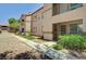 Attractive two-story home exterior with a well-maintained garden and inviting entryway at 9070 Spring Mountain Rd # 114, Las Vegas, NV 89117