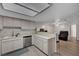 Well-lit kitchen with ample counter space, stainless steel dishwasher, and view into the living room at 9070 Spring Mountain Rd # 114, Las Vegas, NV 89117