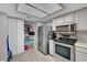 Kitchen boasting stainless steel appliances, plentiful cabinet space, and well-organized pantry at 9070 Spring Mountain Rd # 114, Las Vegas, NV 89117