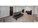 Spacious living room with modern flooring, a sofa and ample room for entertaining at 9070 Spring Mountain Rd # 114, Las Vegas, NV 89117