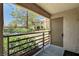 View from porch with black metal safety rails and view of lawn and trees at 9070 Spring Mountain Rd # 114, Las Vegas, NV 89117